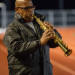 Coach Alvin Little playing the national anthem