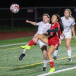 Lindsey Ho looking to trap the ball in Oak Harbors goal box
