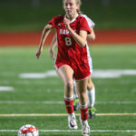 Taitumn Simbulan carrying the ball upfield