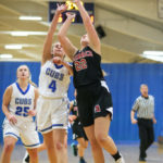 Ainslee Beach making a layup while being chased by Sedro Woolley’s Hannah Jutte