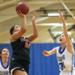 Kierra Scott beats Sedro Woolley’s Heather Vanderbeek to the hoop for 2 points