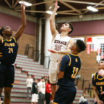 Vitaly Mkrtychyan shooting over Mariner’s Naser Motley