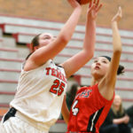 Amber Stradling drives past Marysville-Pilchuck’s Briana Ruiz for two points