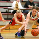 Cameron Dunn and Marysville-Pilchuck’s Lauren Lewis dive for a loose ball