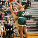 Cameron Dunn being fouled by MG’s Ellie Jackson