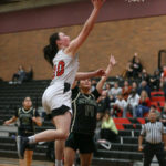 Cameron Dunn driving to the hoop