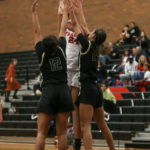 Maya Davis making a contested shot