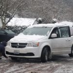 Service truck driver scraping ice, Dec. 23