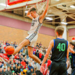 MTHS_s Gabe Towne(33) Lands a dunk against Shorewood HS defenders in Friday nights playoff game. -1