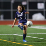 Jamie-Christiansen-passes-the-ball-up-the-line