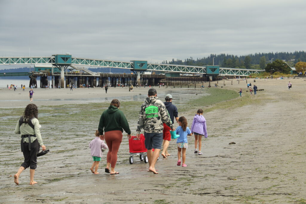 Visitors explore Edmonds waterfront during the lowest tide of the year